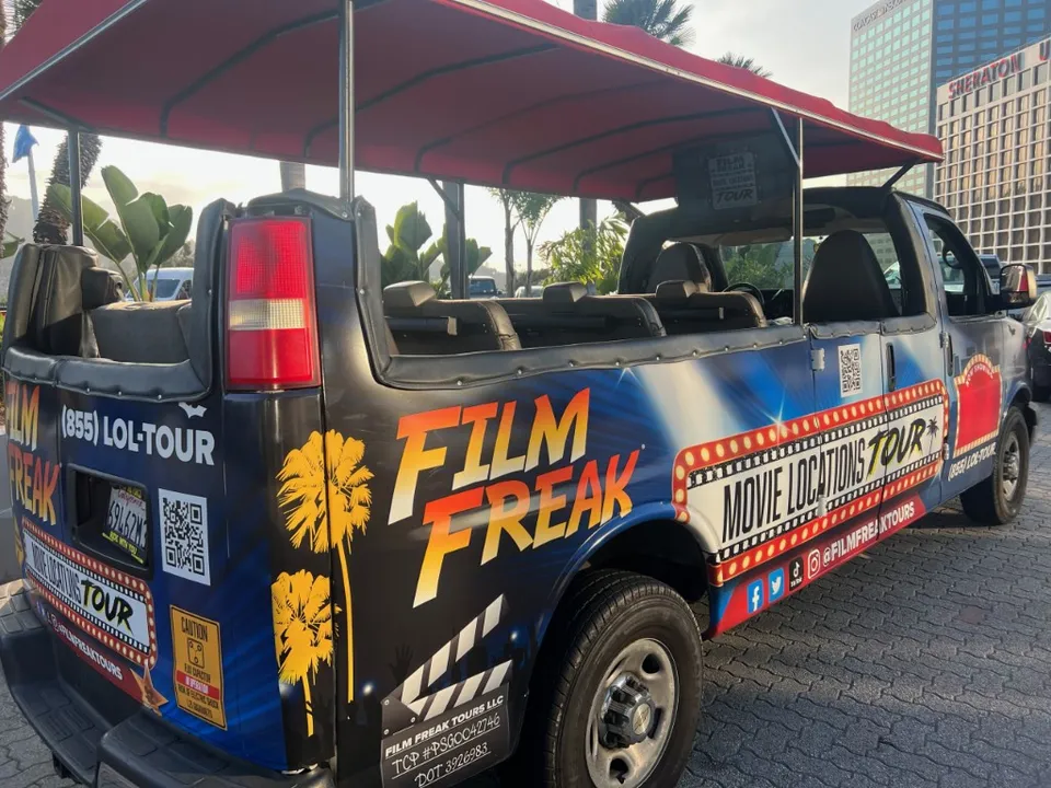 The Film Freak Movie Locations Tour van — custom-wrapped with Film Freak branding, parked in Hollywood, California